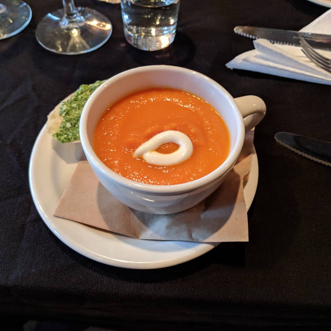 Carrot soup, and a pesto made of the carrot ends on crostini. #craftedstl #pairingdinner