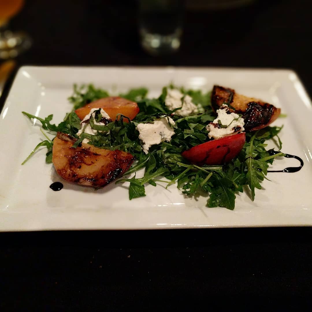 Grilled stonefruit at the #4204mainstreetbrewing pairing dinner at #craftedstl made with the Radler.