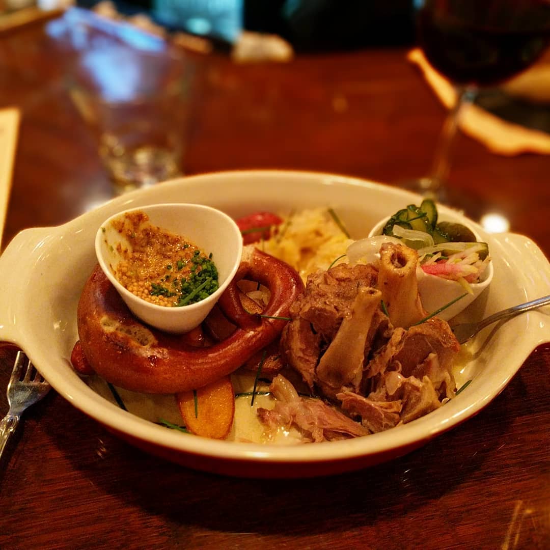 Choucroute Garnie. Smoked pork belly, potato sausage, slow roasted pork shank, apple-fennel kraut, crispy potato, porky pretzel, Dusseldorf mustard and a seasonal pickle. Delicious. #foodporn