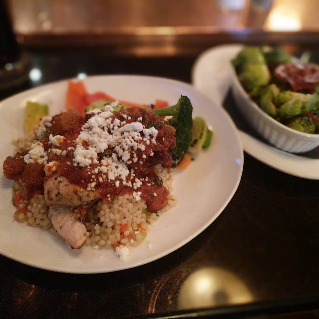 Chicken with a tomato sauce, goat cheese and couscous… With a side of Brussels 
It was absolutely delicious!