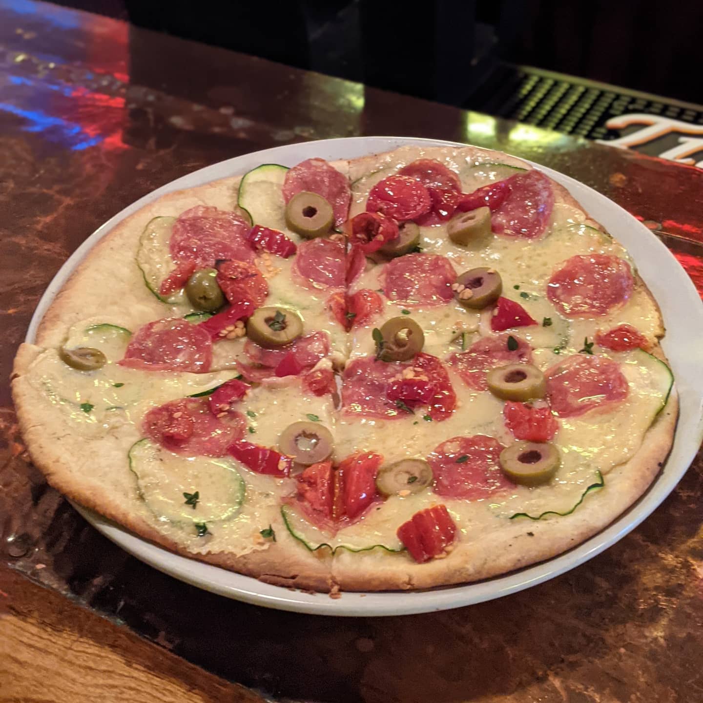 Tonight's #foodporn is at a lovely place near the Christmas Story house in #cleveland. #fatcatstremont . Pizza special... dry Sausage, olive, zucchini and cherry tomatoes. Delicious. Washed down with a rather nice IPA.