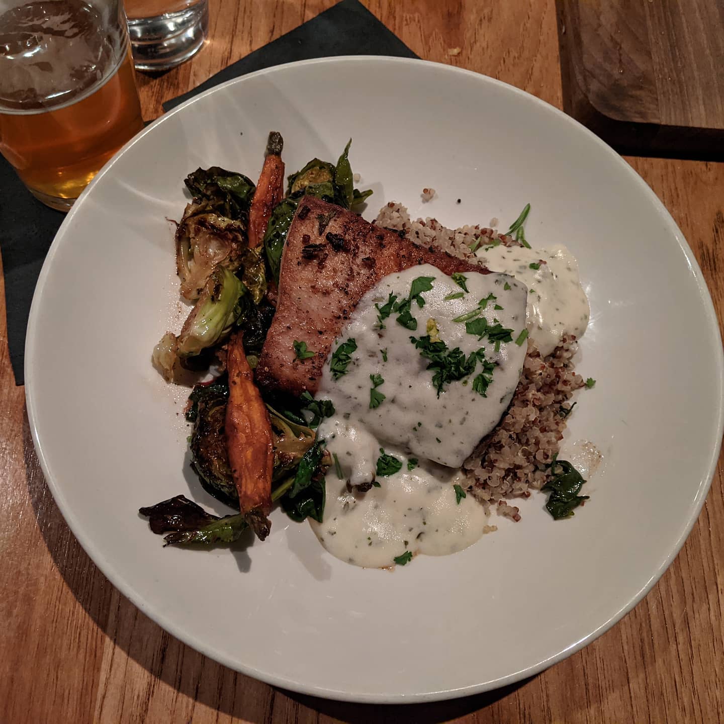 Traveling #foodporn in #tuscaloosa at The River restaurant overlooking the Black Warrior River. Mahi on a herbed Quinoa bed.And a local beer from Black Warrior Brewing as a side ðŸ¤£