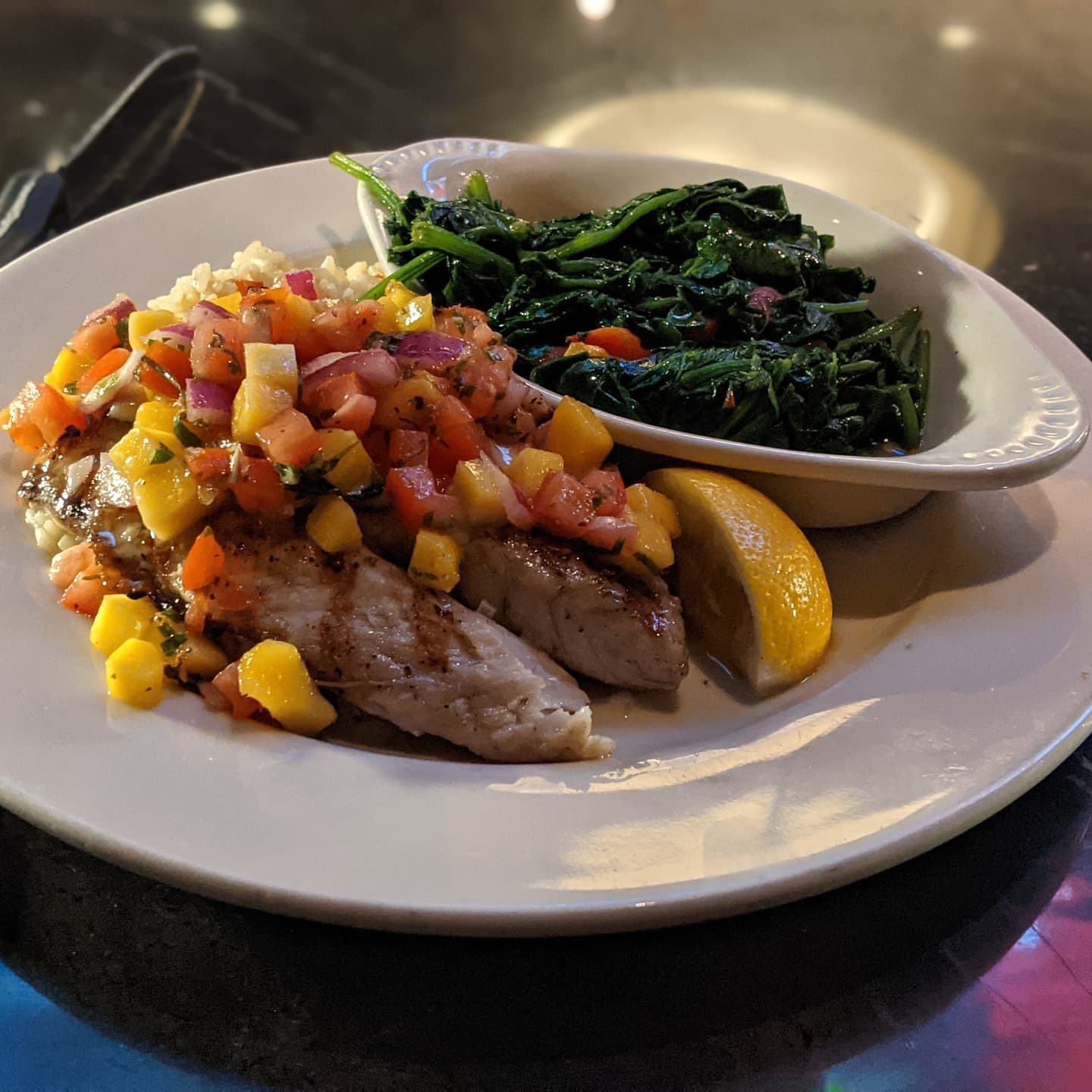 Semi normal #foodporn service resumed. Grilled barramundi with mango salsa and a side of sauteed spinach. And was delicious by the way!